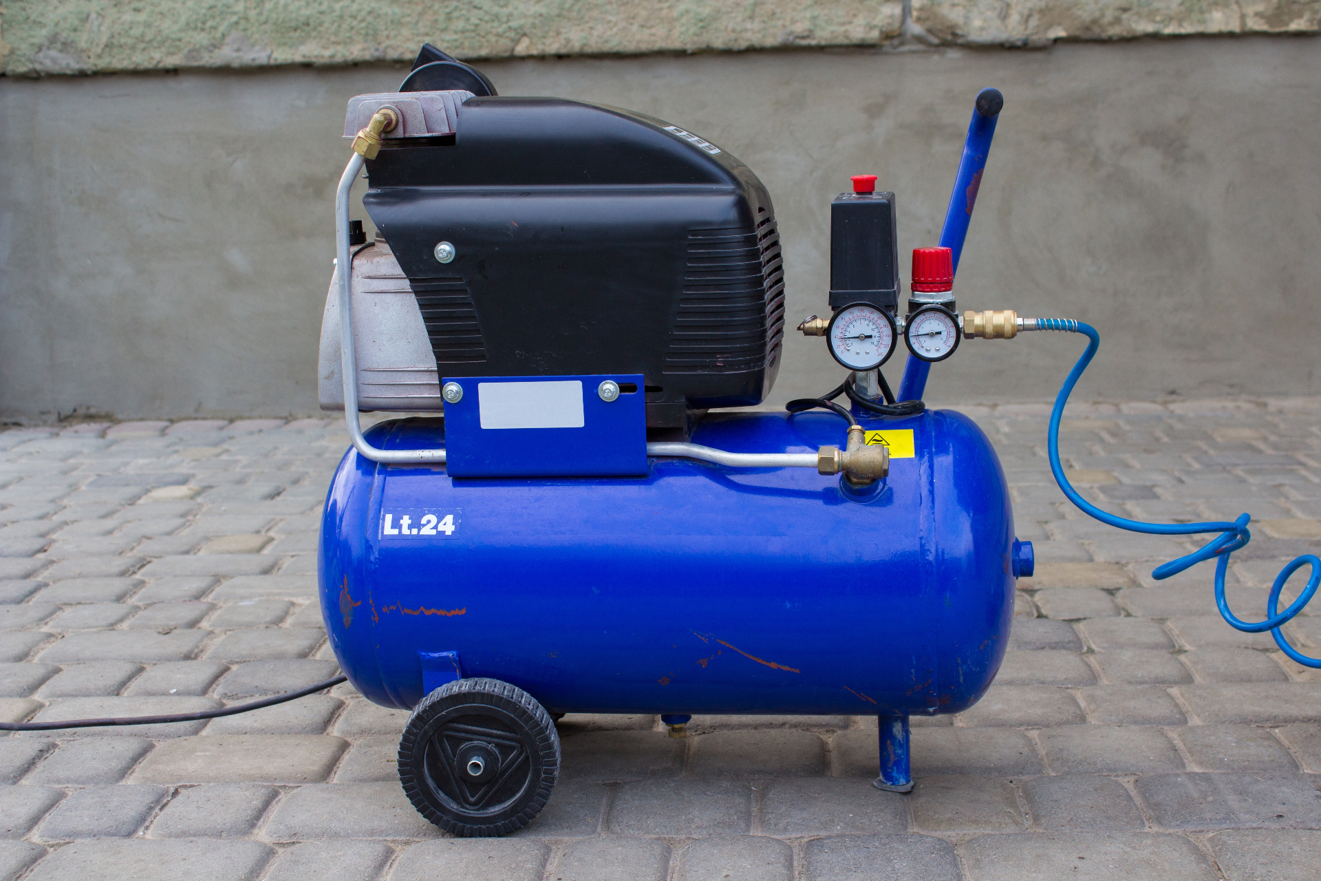 Portable air compressor with pressure gauges