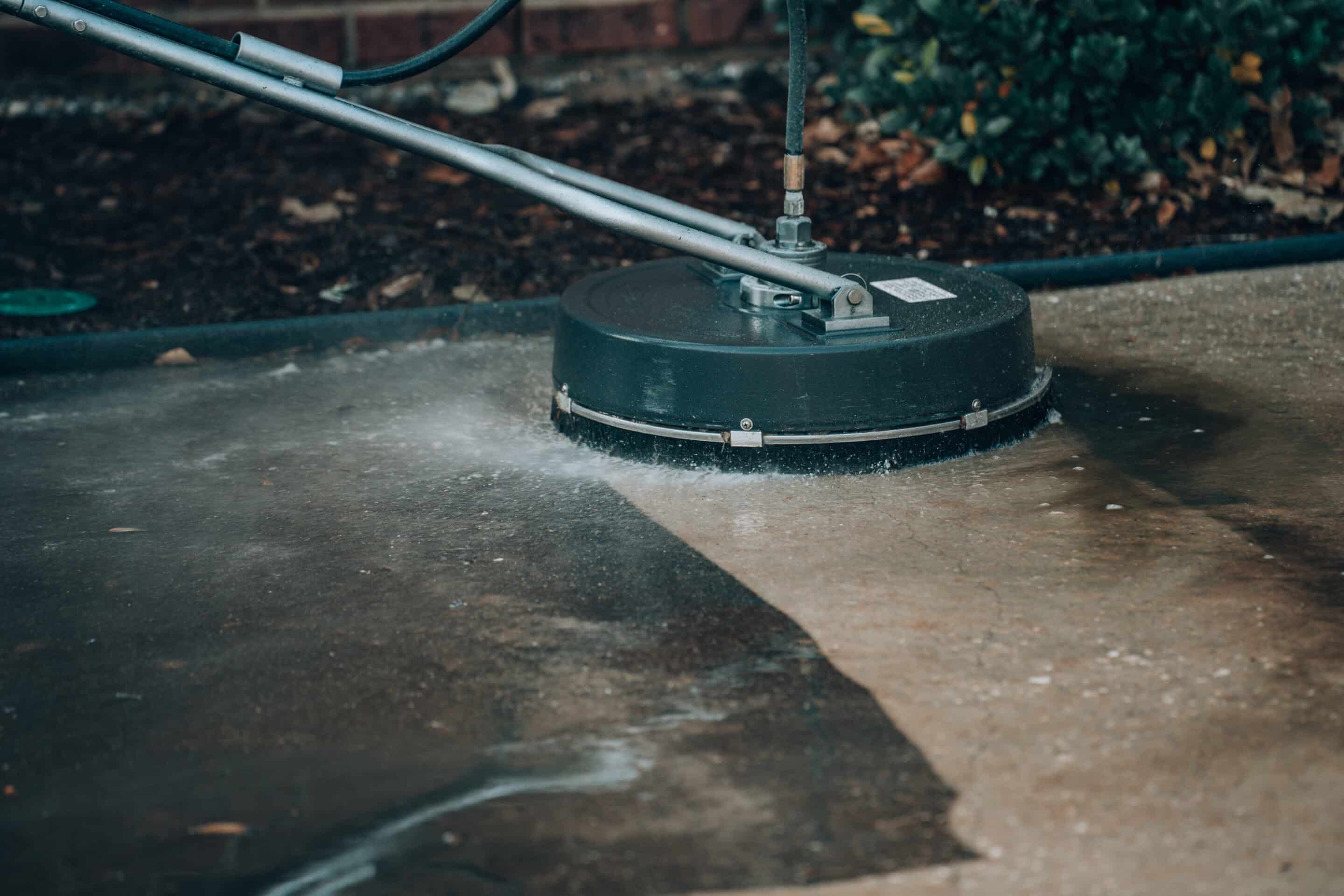 Close up pressure washing drive way, pressure washer, pressure cleaner